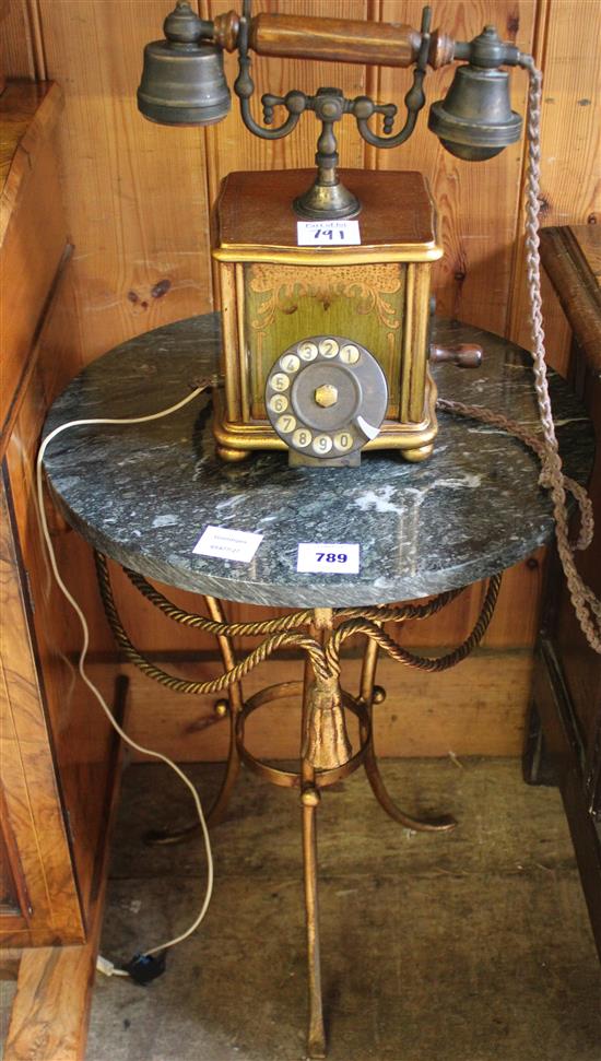 Gilt metal tasselled marble topped table and a reproduction gilt painted telephone receiver (2)